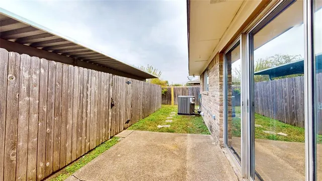a view of a backyard with pathway