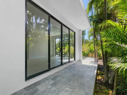 a view of a glass door with a balcony