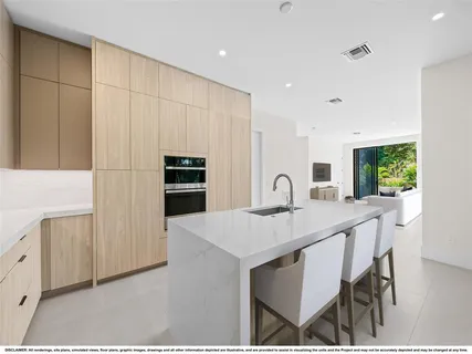 a kitchen with a table chairs refrigerator and microwave