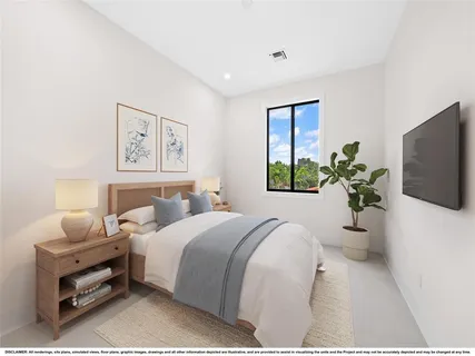 a bedroom with a bed and a couch