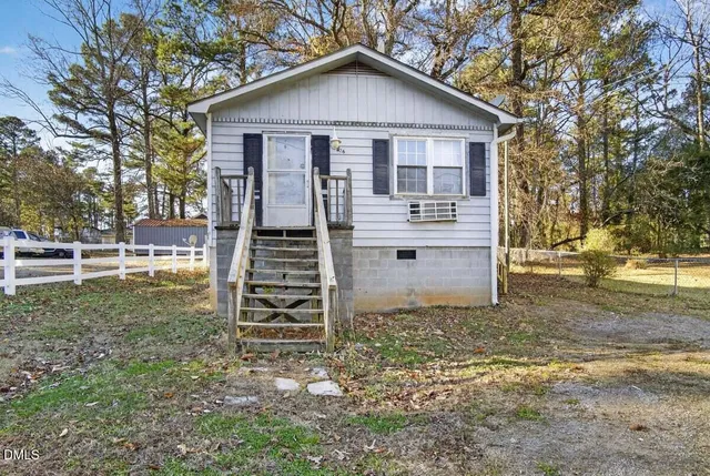 an aerial view of a house with outdoor space
