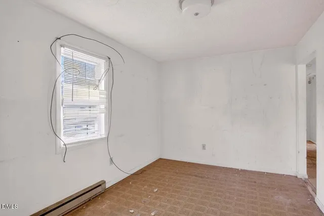 a view of an empty room and window