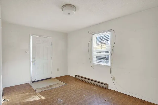 a view of an empty room with a window