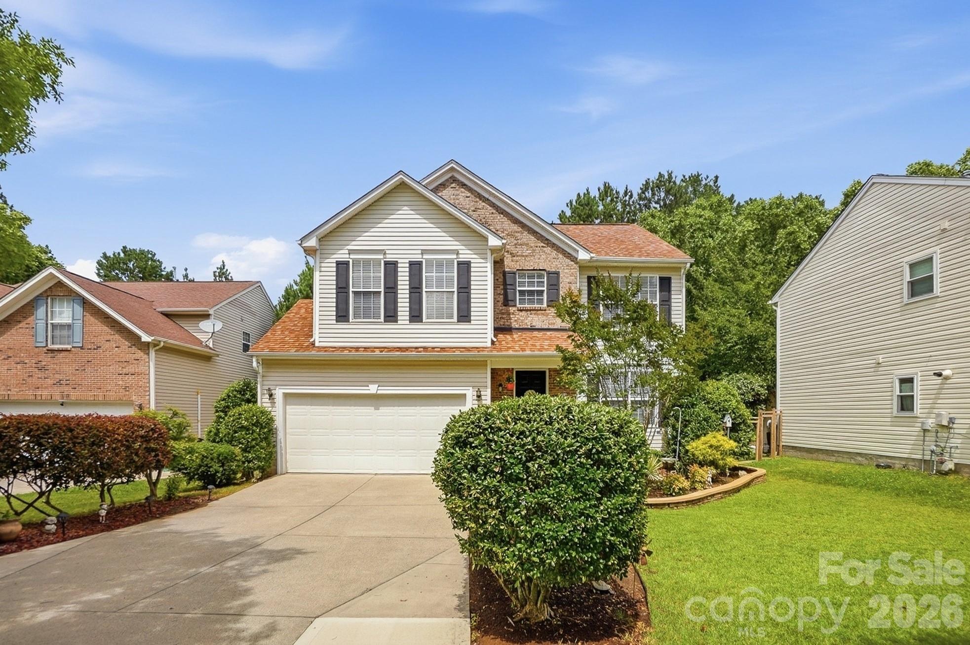 442 Sugar Maple Drive Tega Cay, SC 29708 - Photo 2 of 48 a front view of a house with a yard