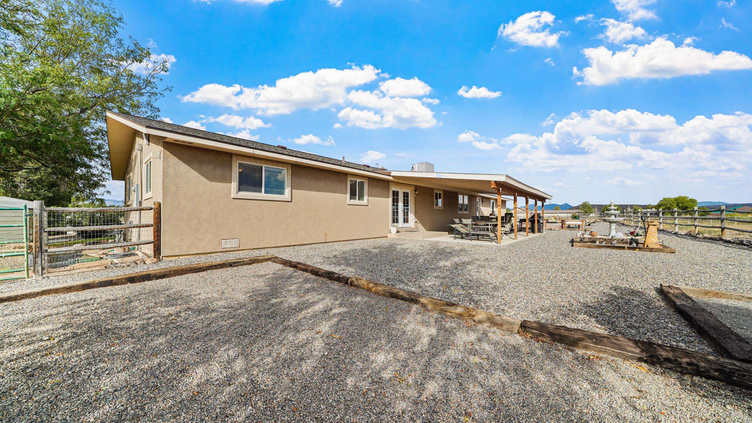 20786 Iris Road Austin, CO 81410 - Photo 29 of 38 a view of an house with backyard and patio
