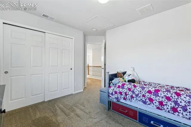 a living room with furniture and flowers