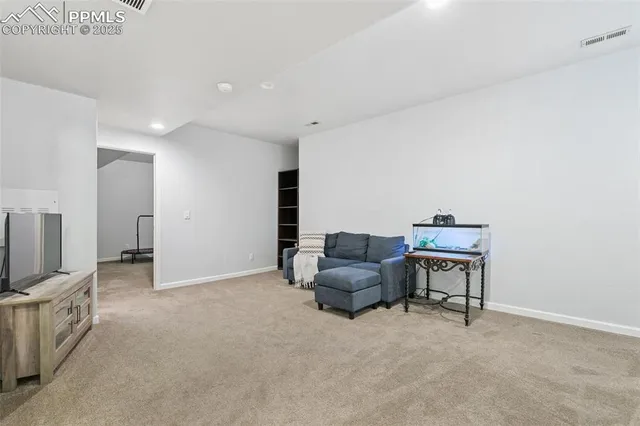 a view of livingroom with furniture and a flat screen tv