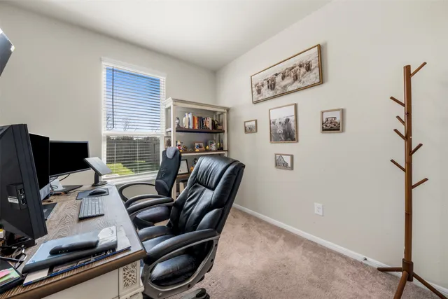 a view of workspace with wooden floor windows
