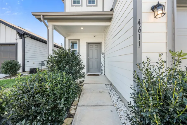 a view of a pathway along with potted plants