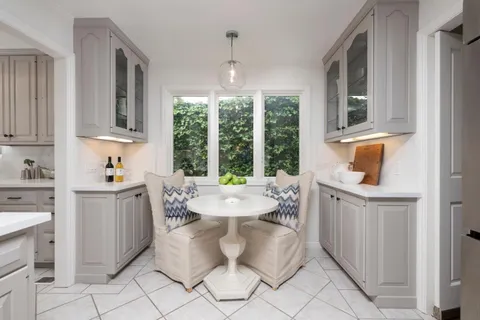 a room with granite countertop lots of furniture and window