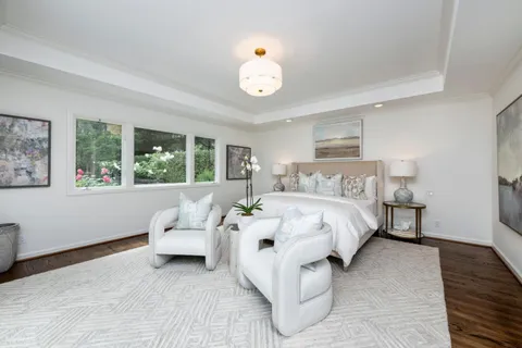 a bed room with a bed and a window