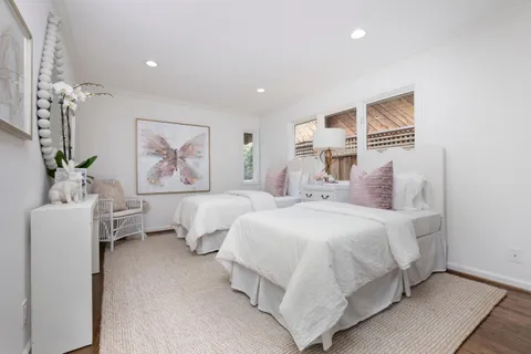 a bedroom with furniture and a chandelier