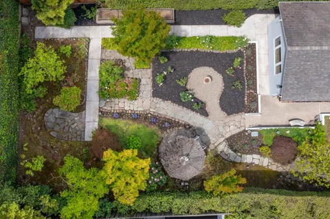 an aerial view of a house with a garden