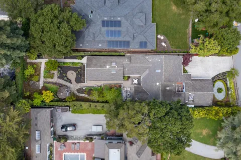 an aerial view of a house with a garden