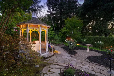a front view of a house with garden
