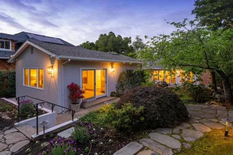 a front view of house along with green space