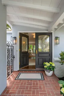 a view of front door with potted plant
