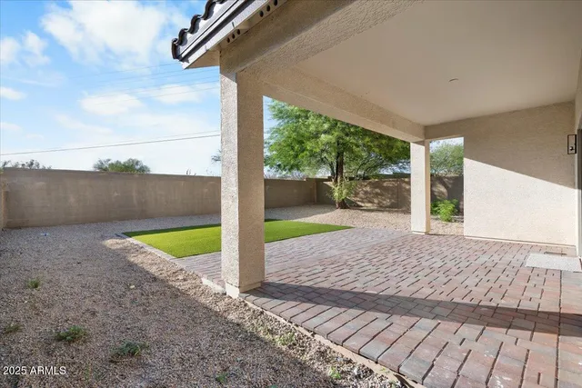 a view of a backyard with porch