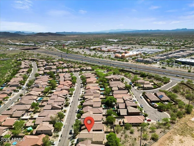 an aerial view of residential building and ocean