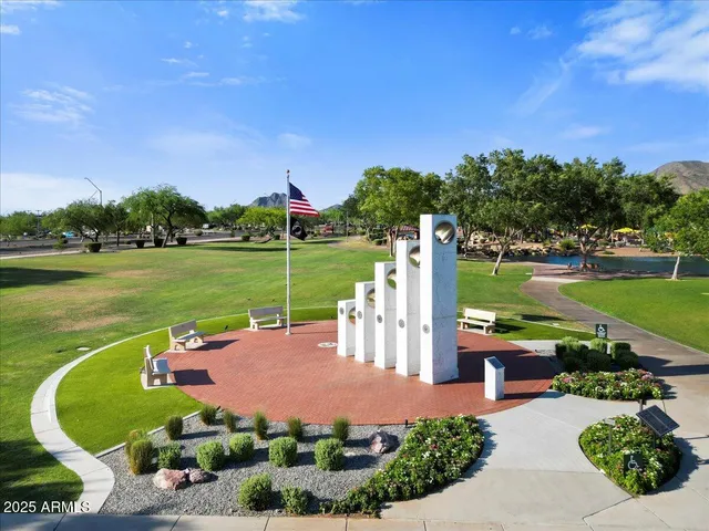 a view of a garden with sitting area
