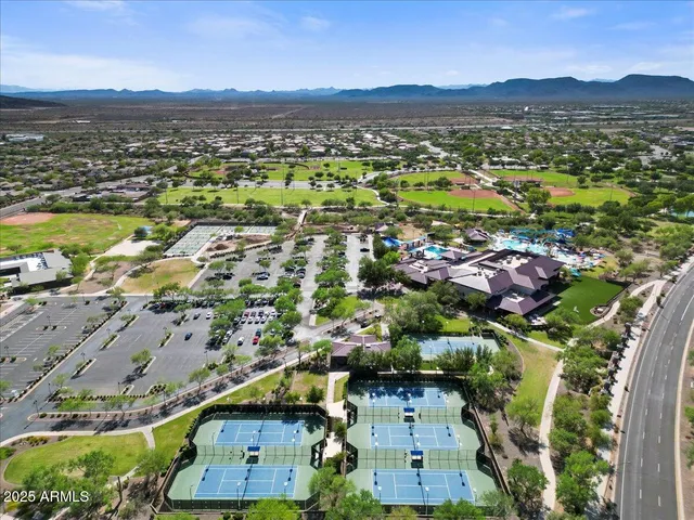 an aerial view of residential houses with outdoor space