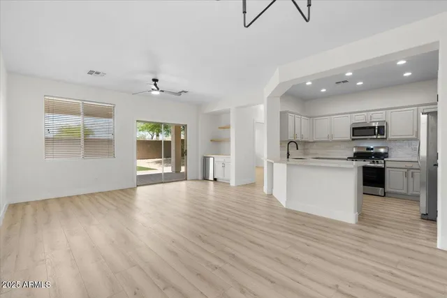 a view of kitchen with cabinets and wooden floor