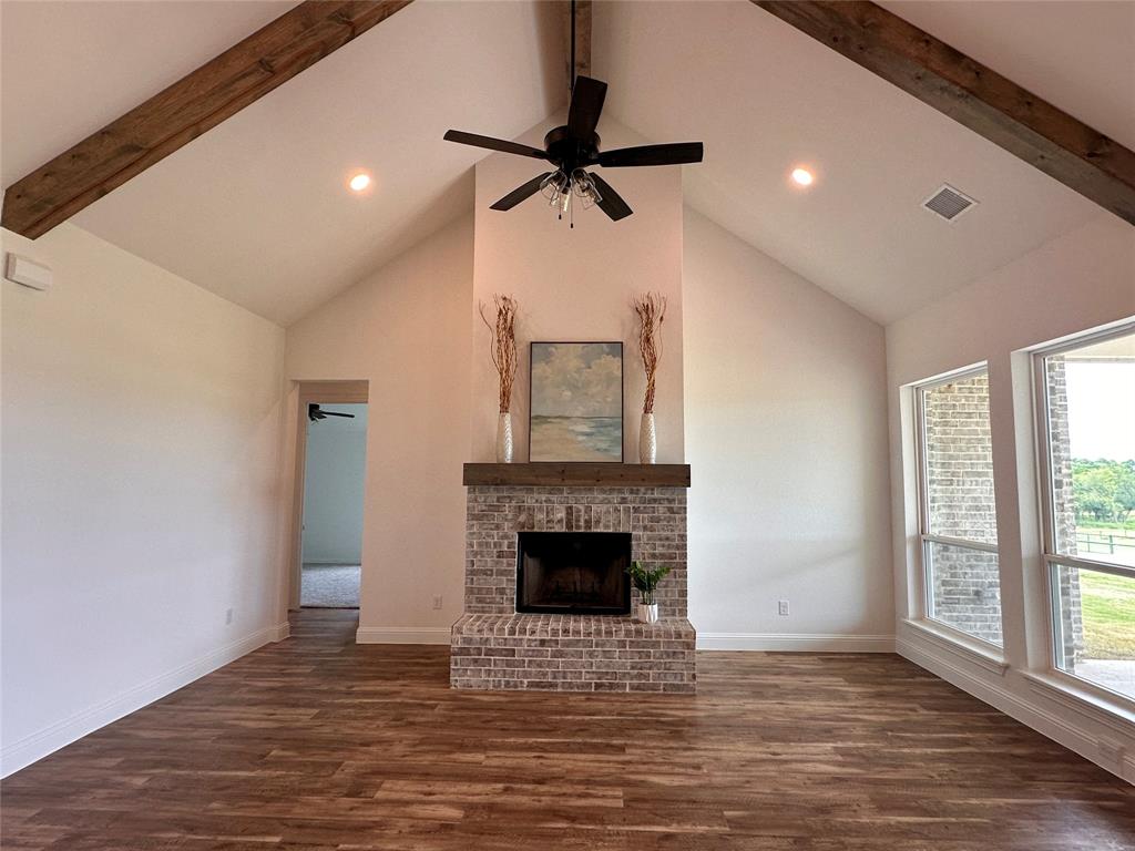 2284 Erwin Road Poolville, TX 76487 - Photo 5 of 30 Open living room with beautiful wood beams