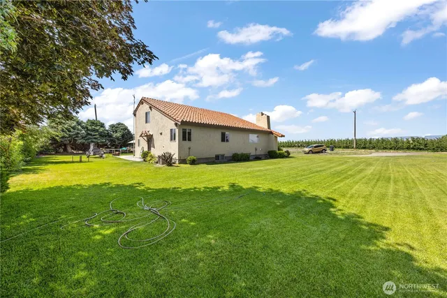 a view of a house with a big yard