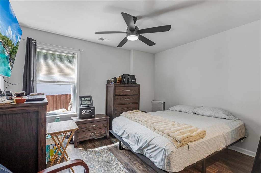 575 Walnut Grv Way Pendergrass, GA 30567 - Photo 30 of 39 a bedroom with a bed dresser and a window