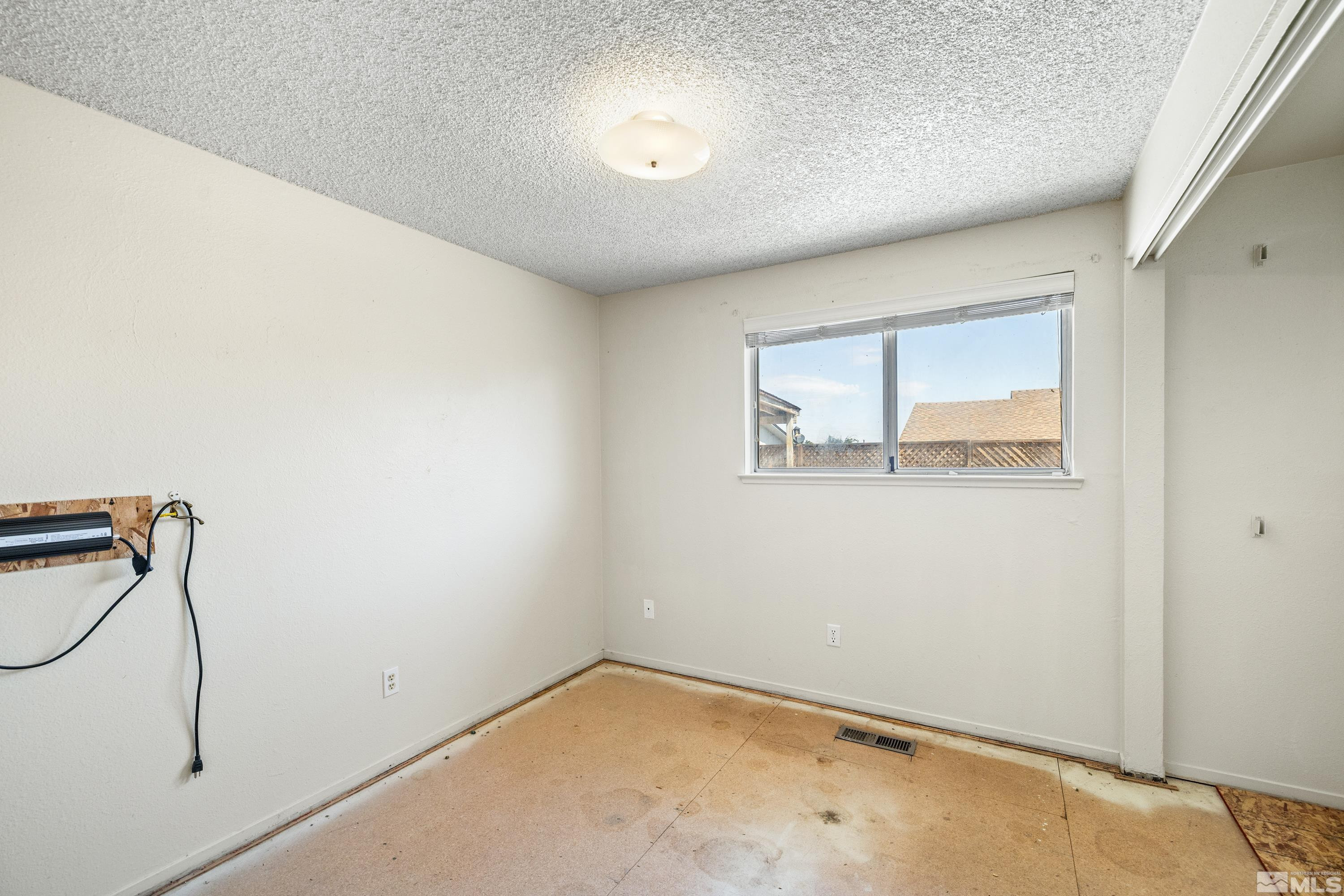 6827 Flower Street Reno, NV 89506 - Photo 19 of 31 a view of a room with rack on the wall