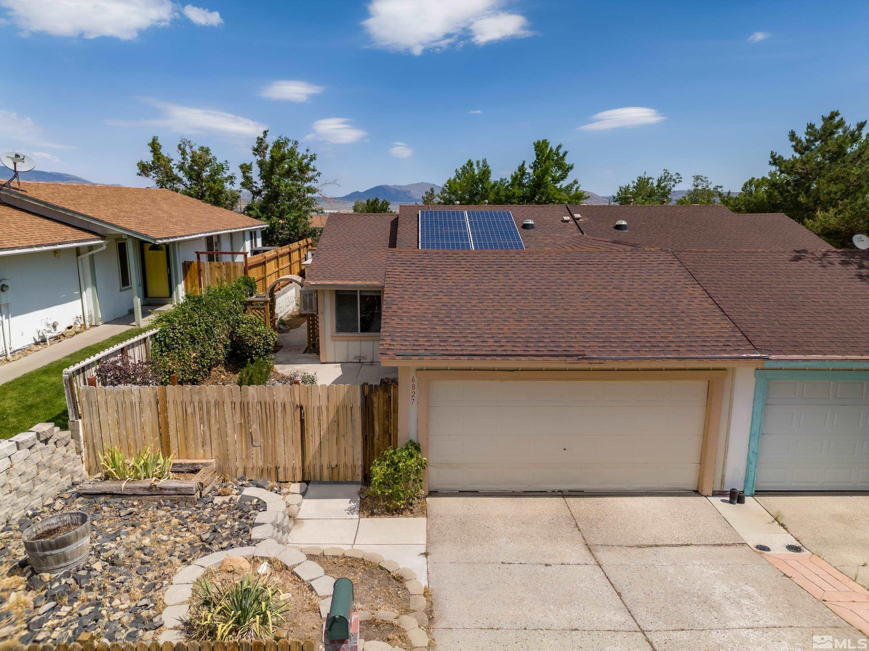 6827 Flower Street Reno, NV 89506 - Photo 26 of 31 front view of house with a yard