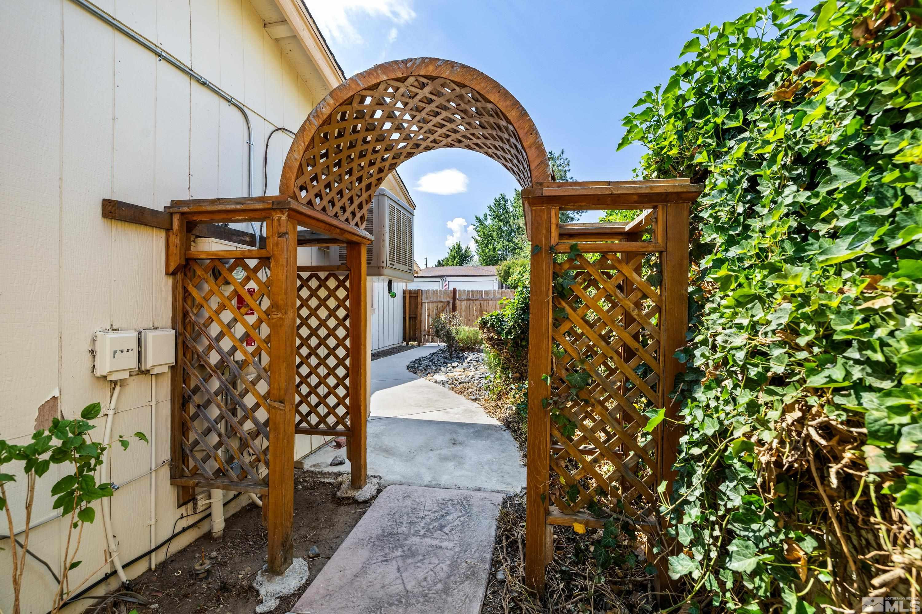 6827 Flower Street Reno, NV 89506 - Photo 3 of 31 a view of entryway with garden