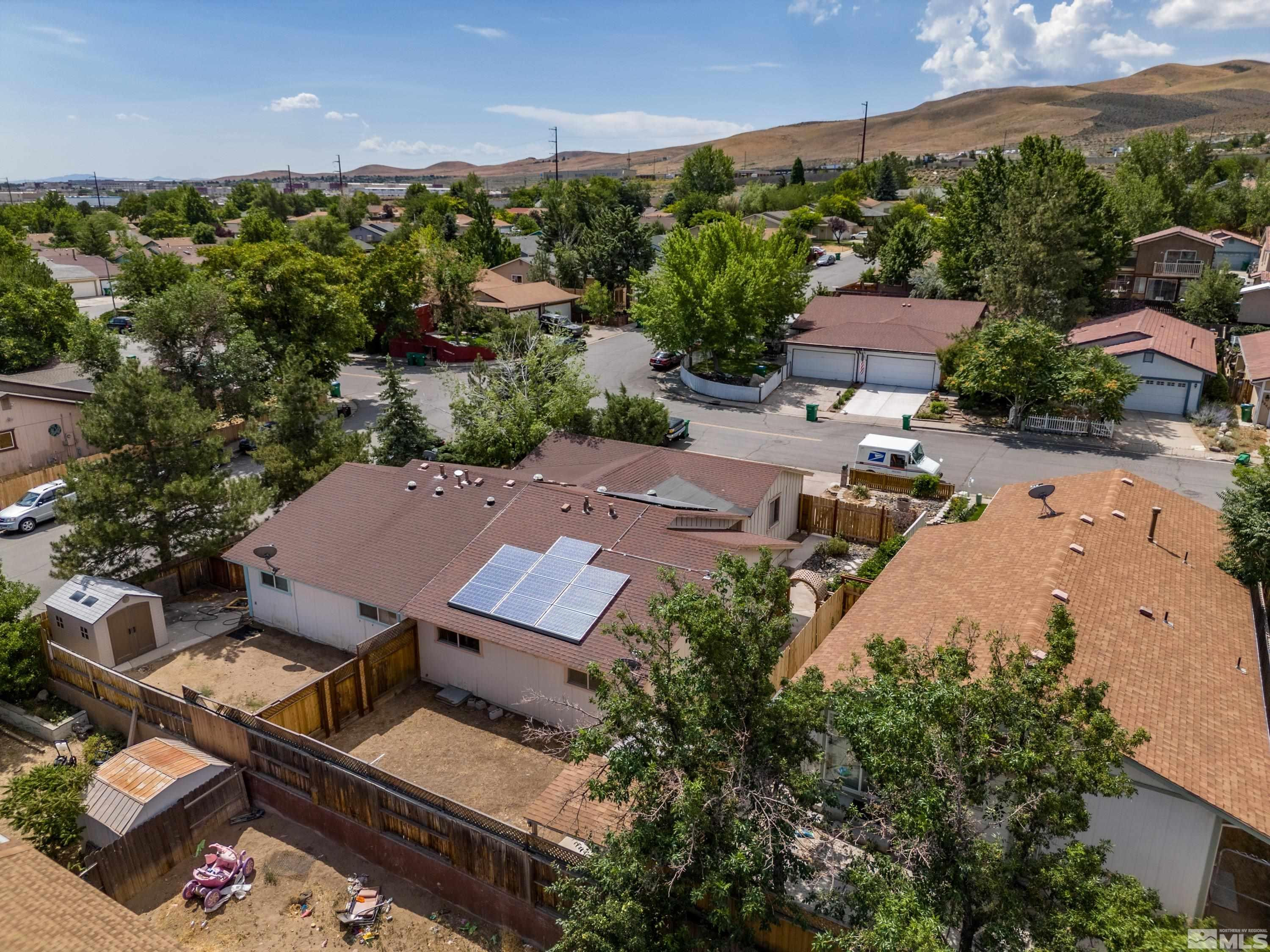 6827 Flower Street Reno, NV 89506 - Photo 31 of 31 an aerial view of a house with a yard