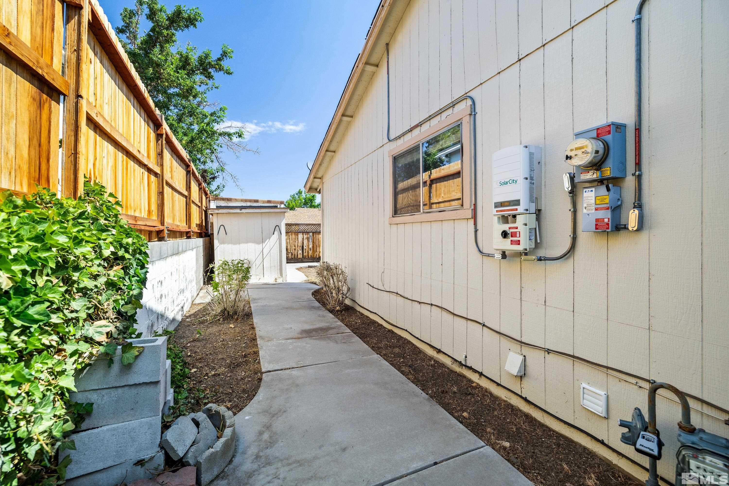 6827 Flower Street Reno, NV 89506 - Photo 4 of 31 a house with trees in front of it