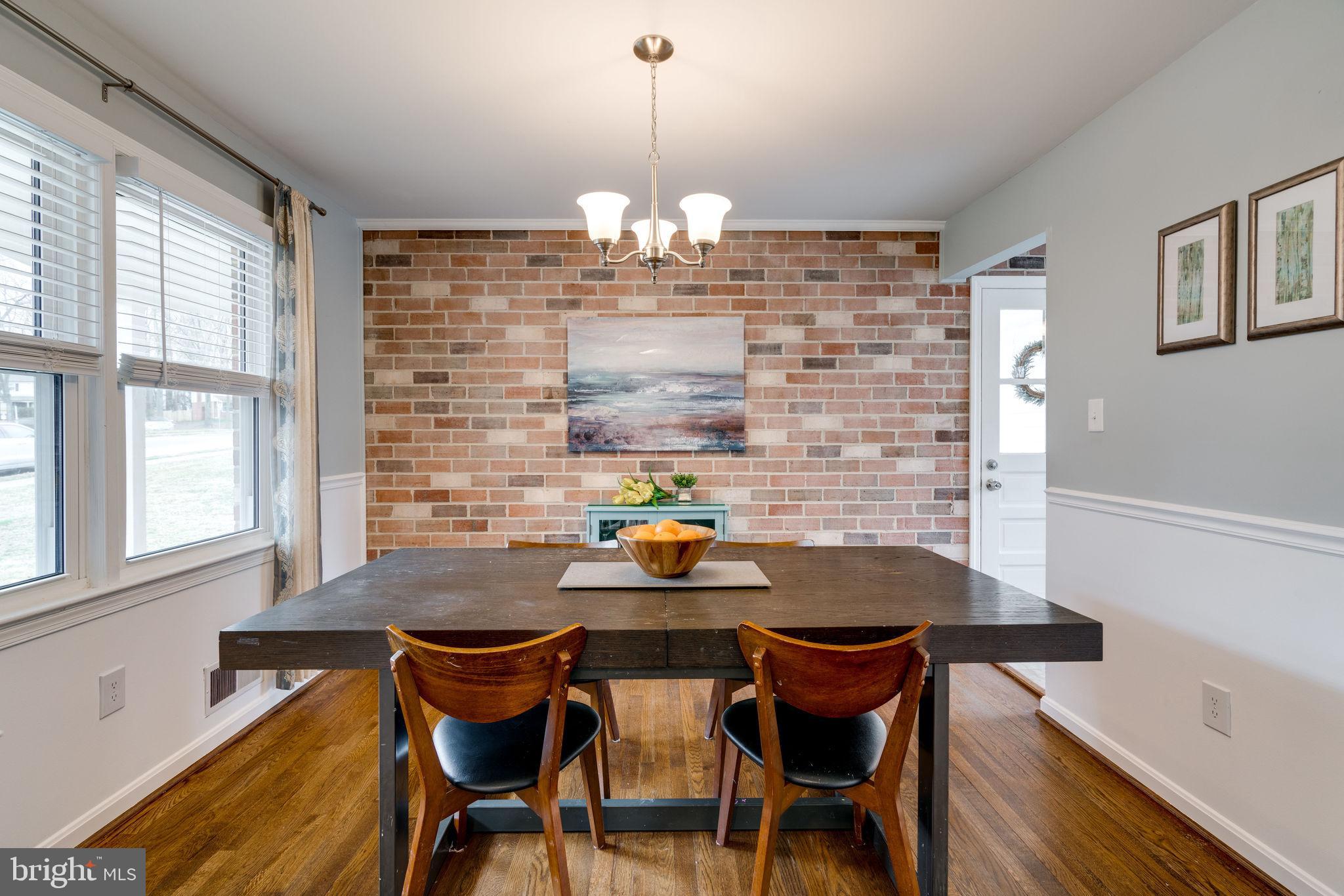 6810 Huntsman Boulevard Springfield, VA 22152 - Photo 14 of 73 large dining room with hardwoods