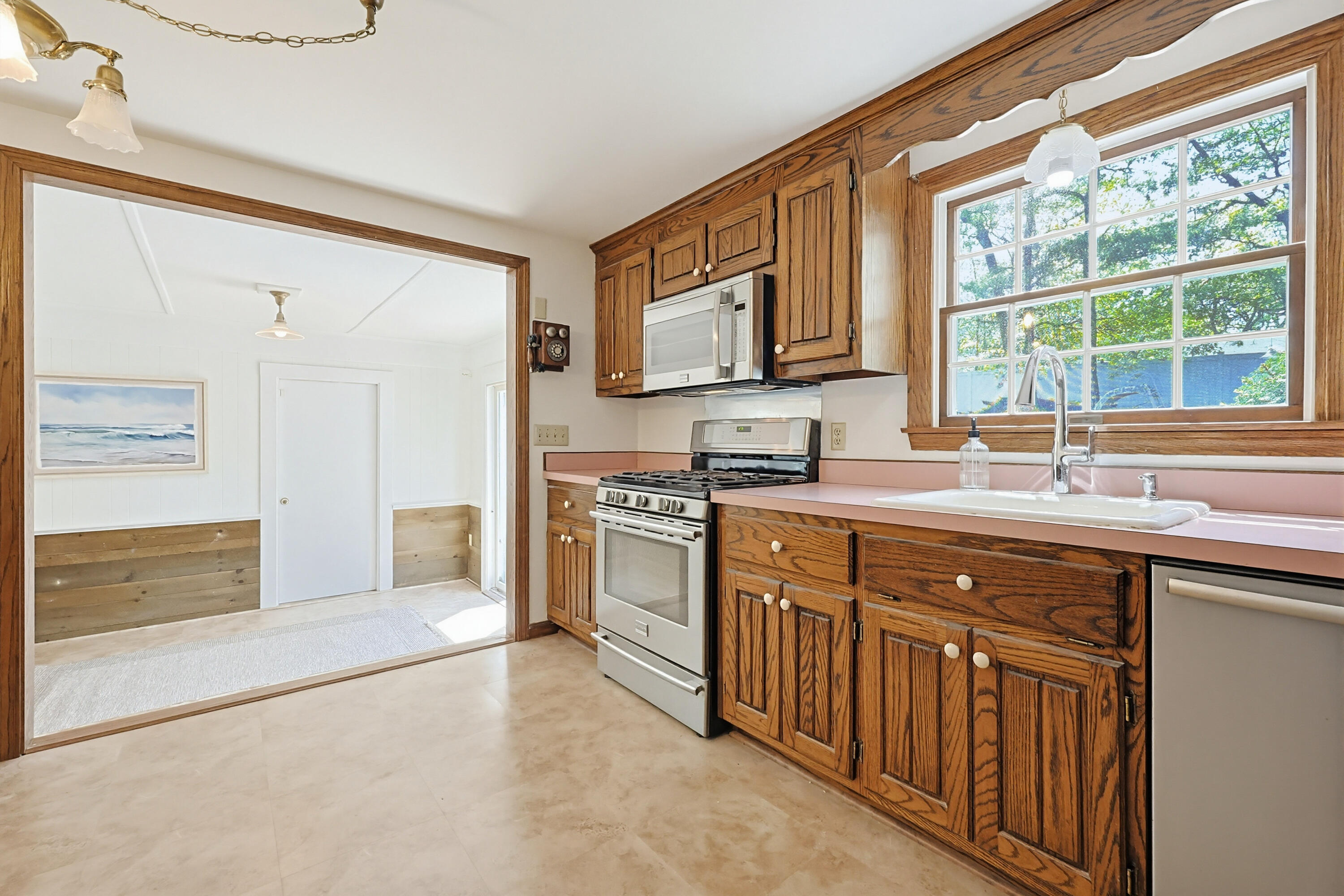 556 Cotuit Road Mashpee, MA 02649 - Photo 17 of 45 a kitchen with stainless steel appliances granite countertop a stove and a sink