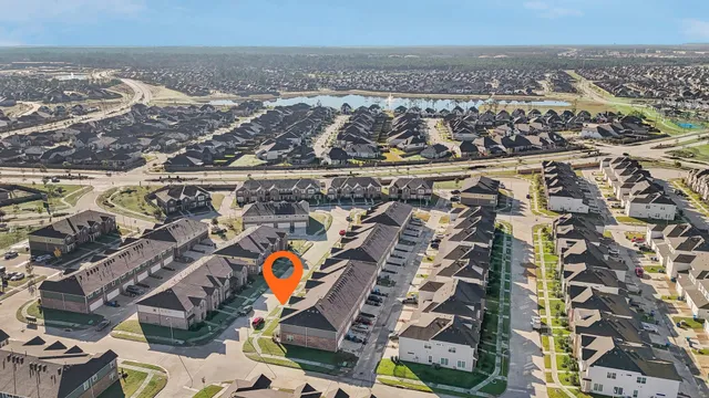 an aerial view of residential building and parking space