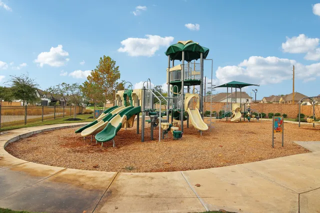 a view of a park with swings