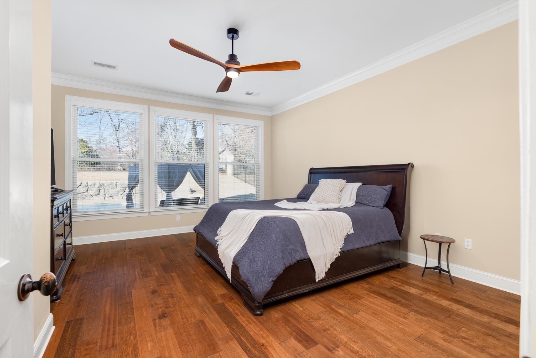 104 Eagle Trace Road Covington, TN 38019 - Photo 18 of 40 Bedroom with dark wood-style flooring, ornamental molding, and a ceiling fan