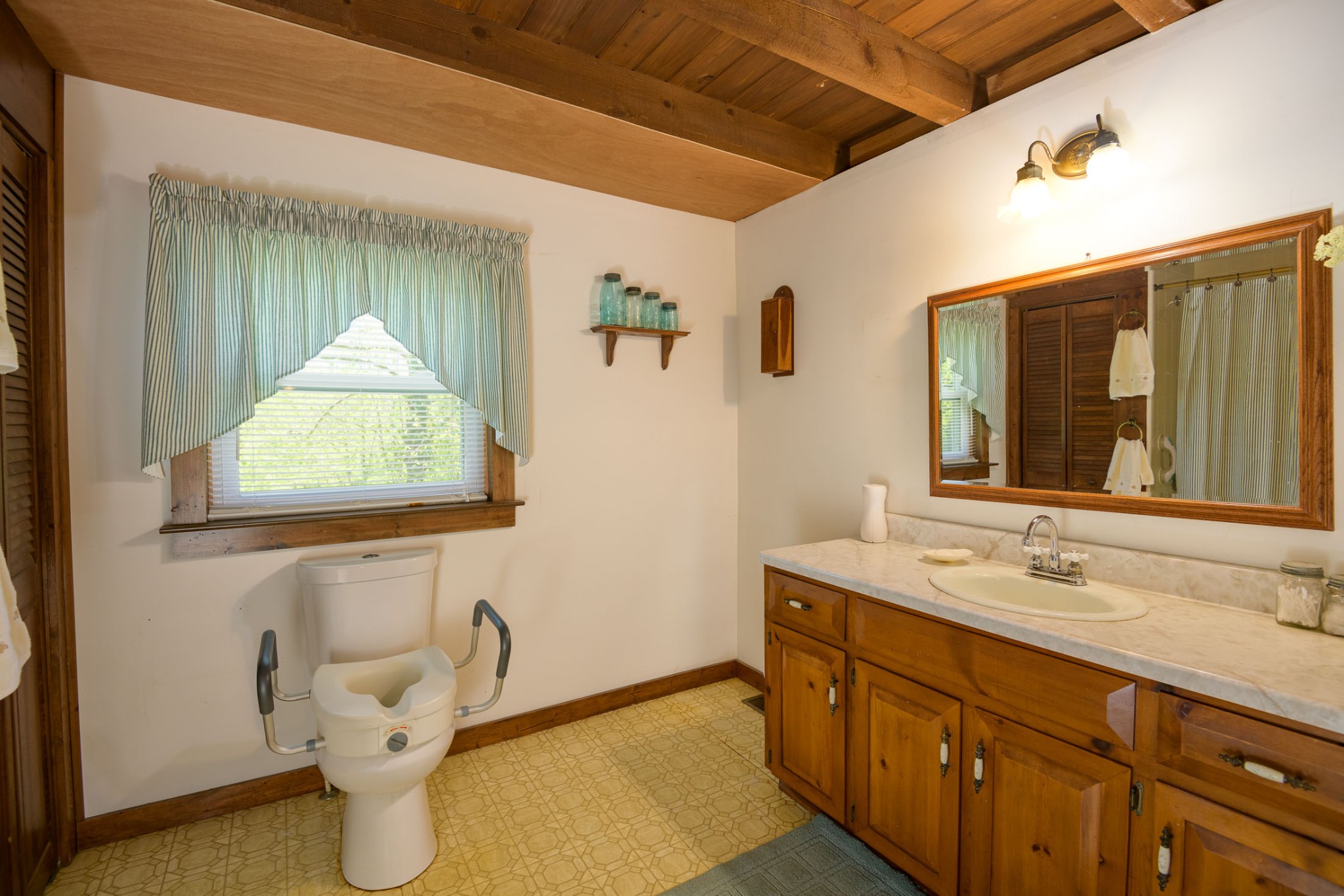 4496 Lower Helton Road Alexandria, TN 37012 - Photo 11 of 40 a bathroom with a sink and a mirror