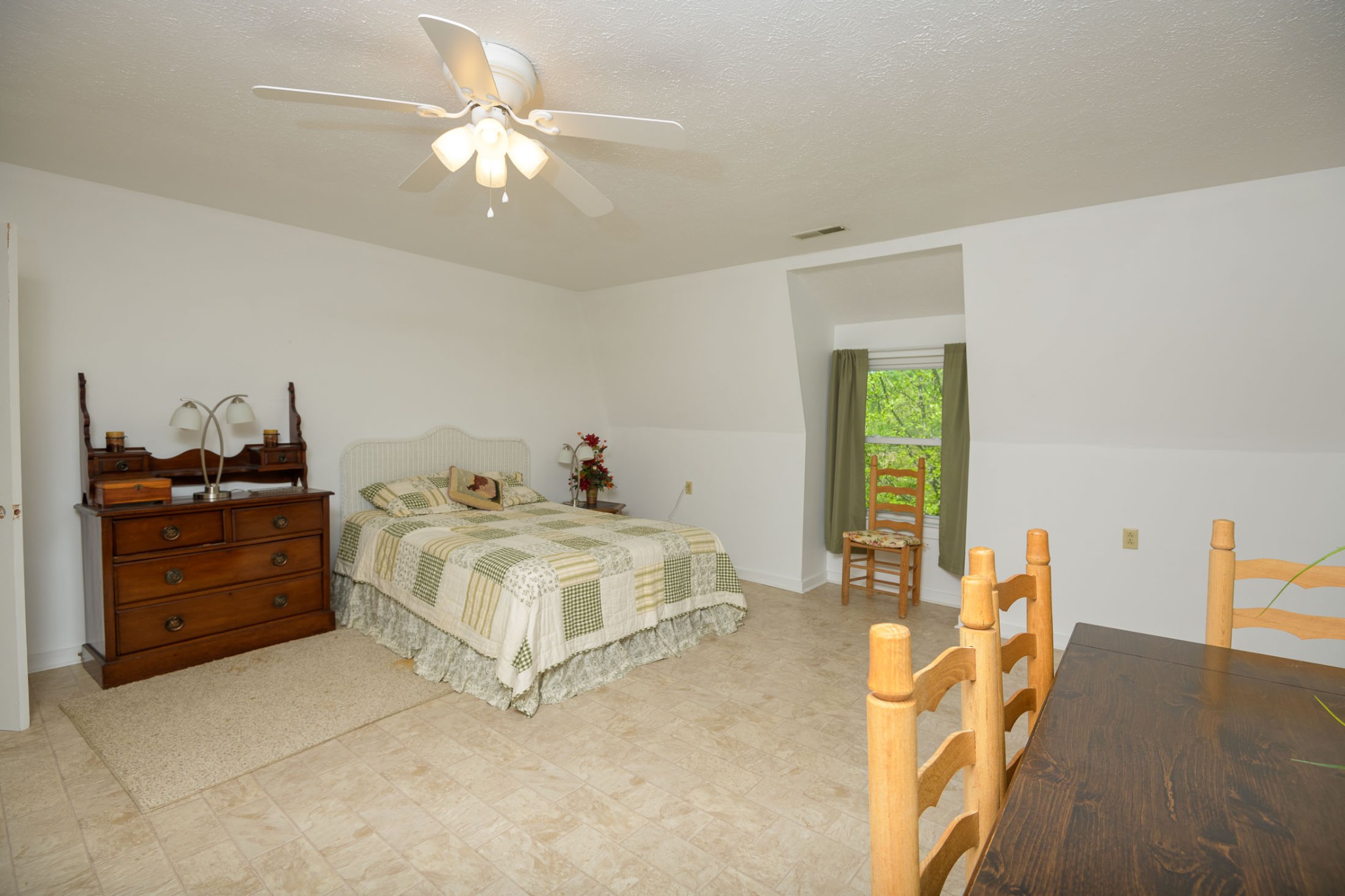 4496 Lower Helton Road Alexandria, TN 37012 - Photo 12 of 40 a white bed sitting in a bedroom next to a window