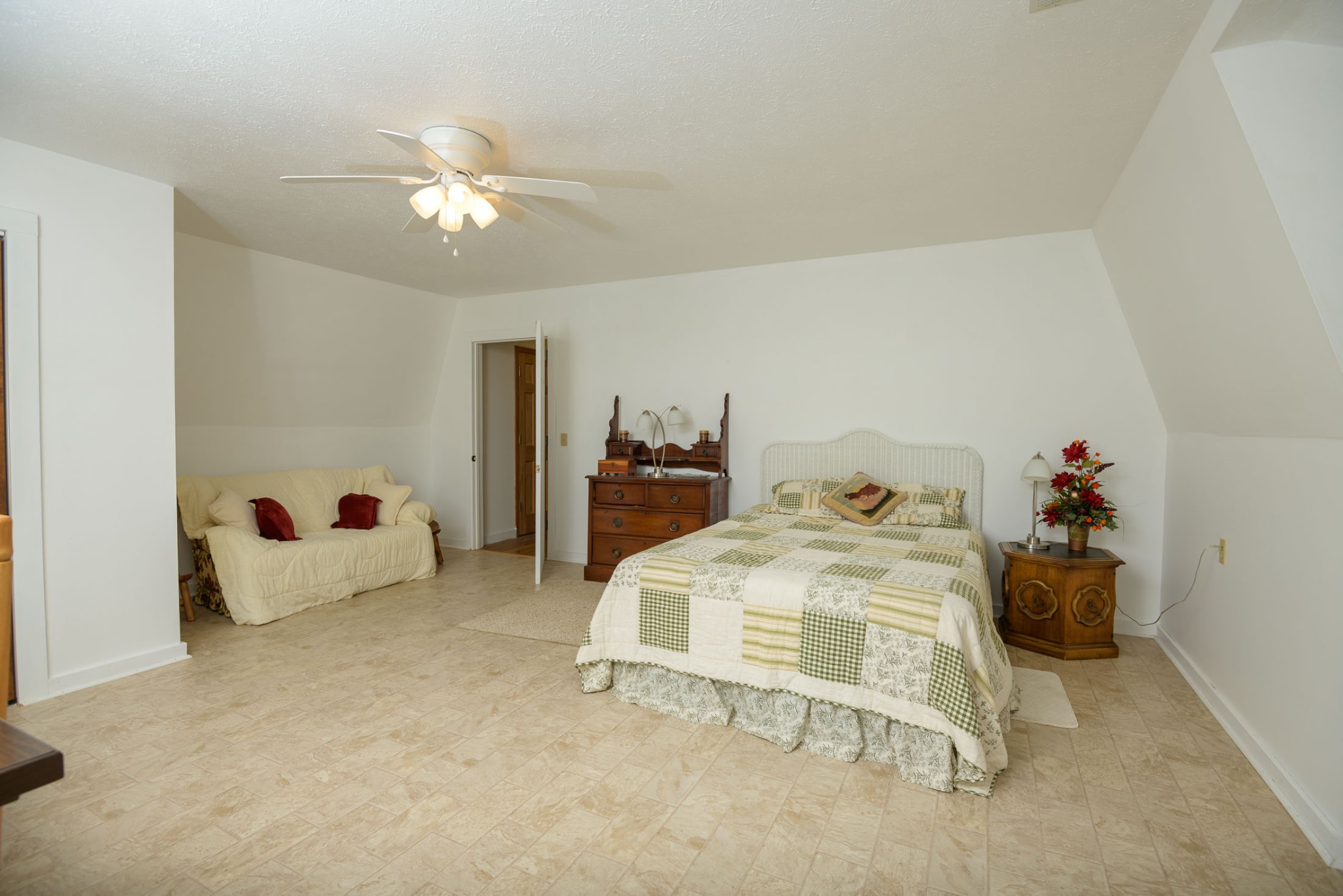 4496 Lower Helton Road Alexandria, TN 37012 - Photo 14 of 40 a bedroom with a bed and ceiling fan
