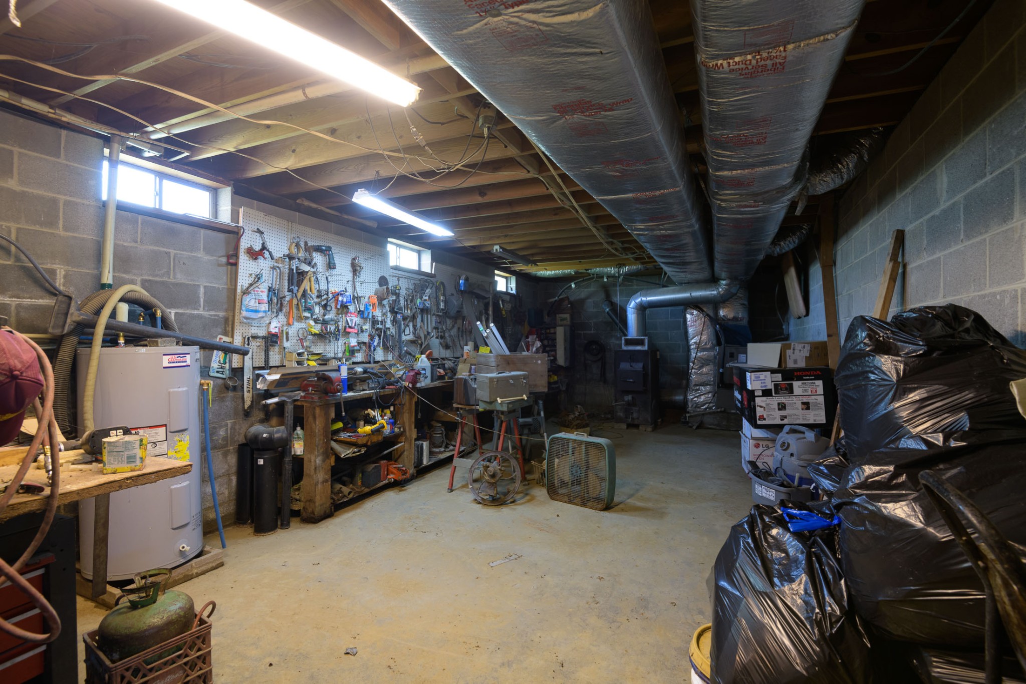 4496 Lower Helton Road Alexandria, TN 37012 - Photo 18 of 40 a view of a storage room with gym equipment