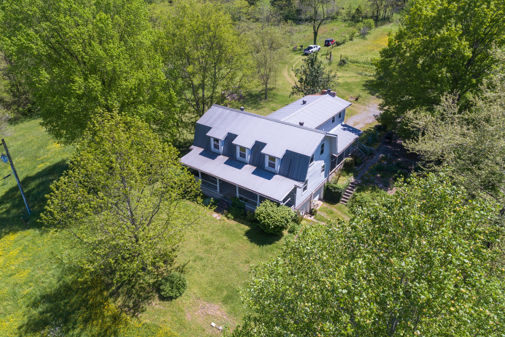 4496 Lower Helton Road Alexandria, TN 37012 - Photo 20 of 40 an aerial view of a house with a yard and large tree