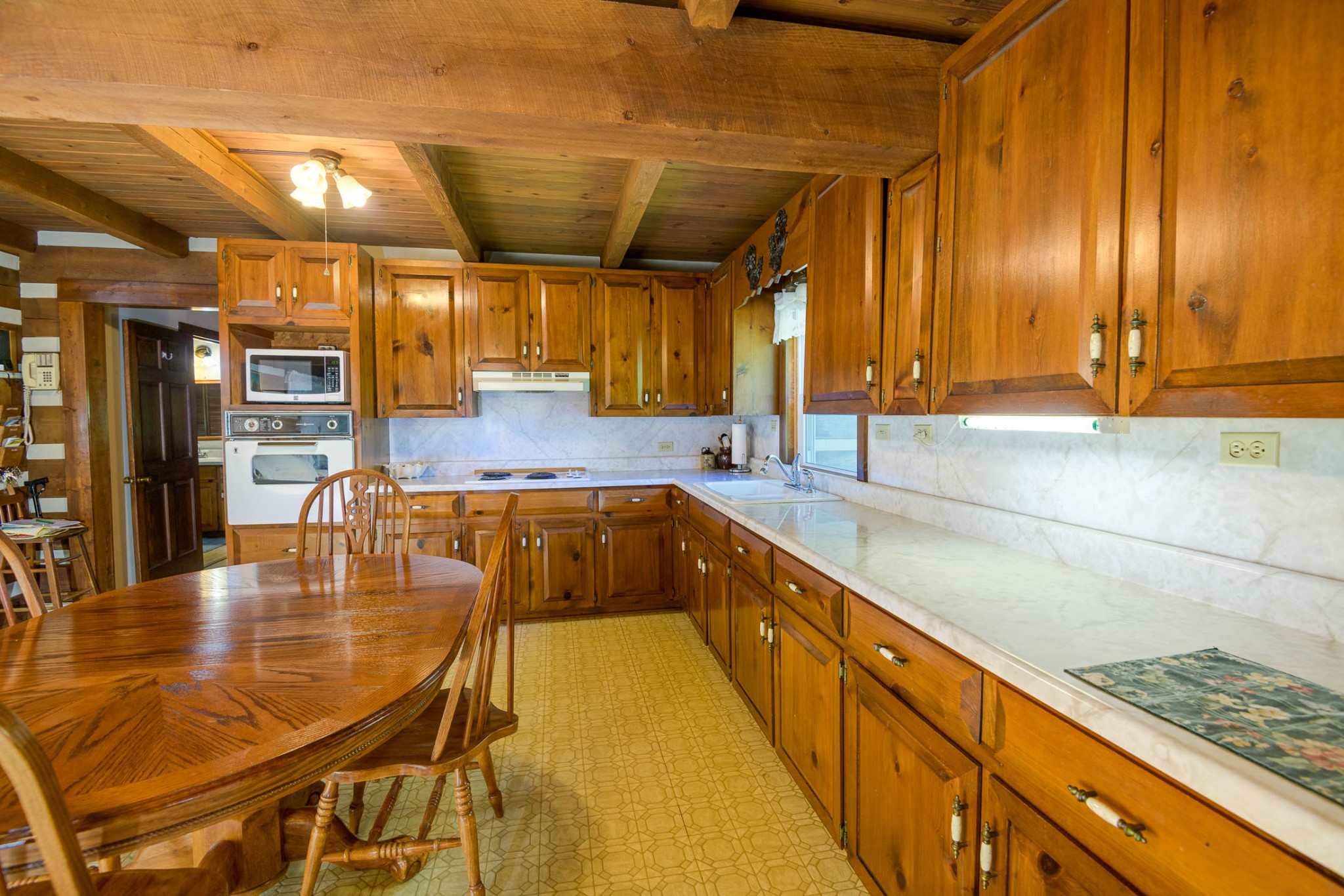 4496 Lower Helton Road Alexandria, TN 37012 - Photo 10 of 40 a kitchen with stainless steel appliances granite countertop a sink a counter space and cabinets