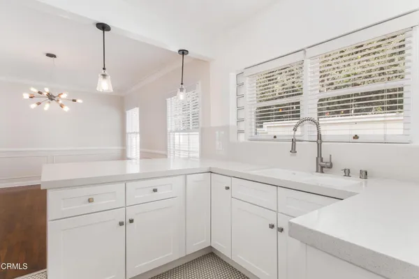 a bathroom with a sink and a window