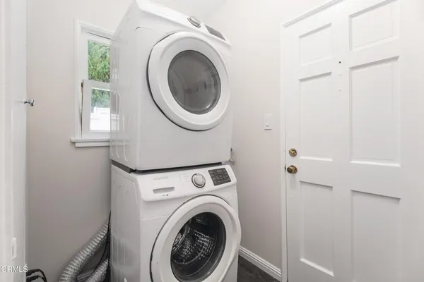 a view of a hallway with washer and dryer