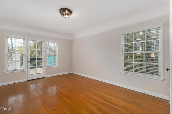 a view of an empty room with a window