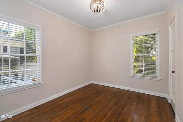 a view of a house with a tree
