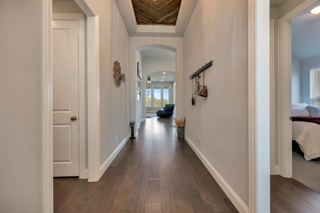 1129 Highpoint Way Roanoke, TX 76262 - Photo 2 of 26 a view of hallway with wooden floor